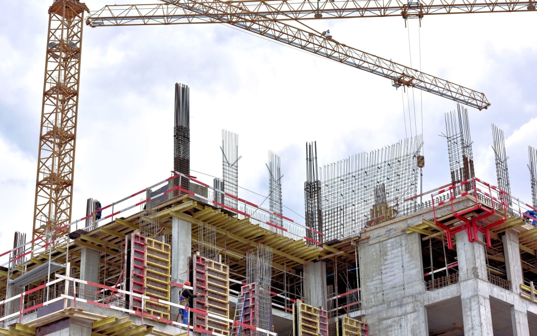 A new building is being constructed with use of tower crane