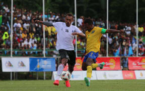 Pacific Games football semi-finals: Solomon Islands captain Micah Lea’alafa (right) attempts a shot at goal under the close supervision of Fiji’s Gabiriele Matanisiga. A Lea’alafa goal sealed Solomon Islands 2-0 victory over Fiji setting up a grand final with New Caledonia. Lawson Tama Stadium, Honiara 28 November 2023