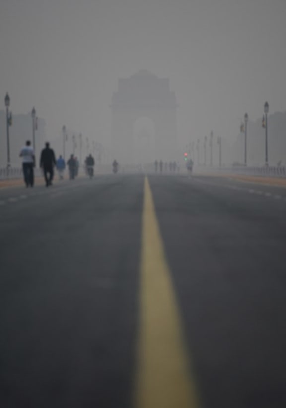 Smog covers India Gate war memorial in New Delhi.