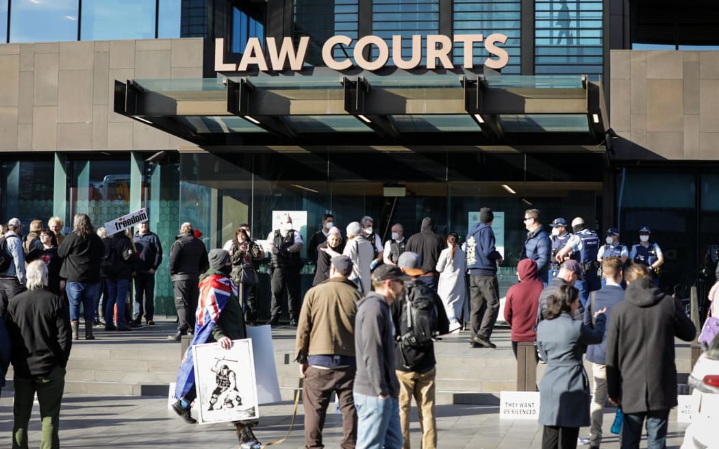 Anti-government protesters have gathered outside the entrance to Christchurch's Court buildings this morning as Counterspin Media hosts were due to appear in court.