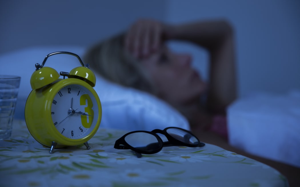 insomniac woman 
Woman struggling to wake up in the morning.