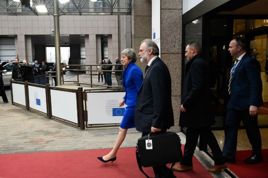Britain's Prime Minister Theresa May leaves after a special meeting of the European Council to endorse the draft Brexit withdrawal agreement.