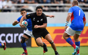 New Zealand's centre Anton Lienert-Brown (C) runs with the ball during the Japan 2019 Rugby World Cup Pool B match between New Zealand and Namibia.