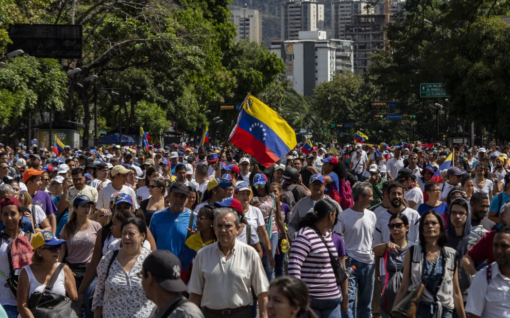 People march against the government of President Maduro.