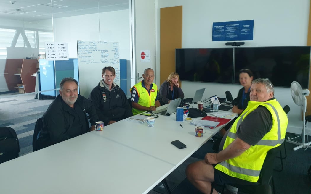 KDC's incident management team in Dargaville is visited by Kaipara Mayor Craig Jepson (right foreground) along with (from left) Cr Gordon Lambeth and Deputy Mayor Jonathan Larsen who is alongside incident management team members Brian Armstrong and Amanda Bennett. Team member Linda Osborne sits alongside the mayor.