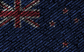 New Zealand flag  is depicted on the screen with the program code. The concept of modern technology and site development.