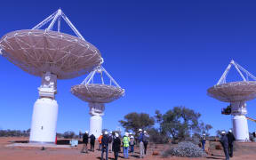 The Australian Square Kilometre Array Pathfinder, or ASKAP, with its 36 dishes, is a precursor to the gigantic SKA telescope.