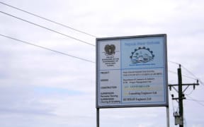 A sign on the perimeter fencing for the  Pacific Marine Industrial Zone (PMIZ) project in Madang, one of the few structures built from almost ten million US dollars spent on the project by Papua New Guinea's government in the past decade.