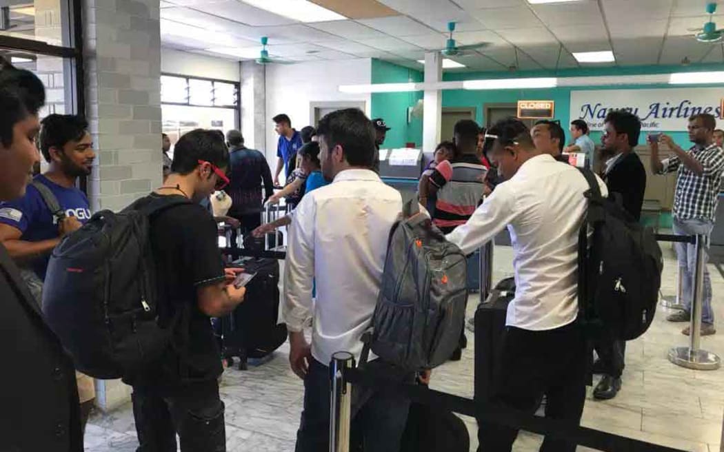 A group of refugees at the airport in Nauru.