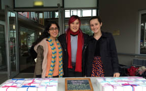 Nikita Kapoor (L) and Sacha Baillie (R) of Feel Good Period, with Bevan Chuang (C) at the Wesley Market.