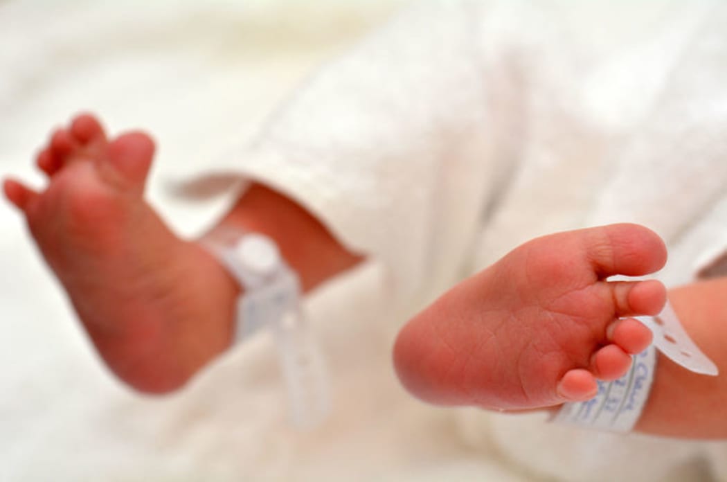 A photo of a newborn baby's feet