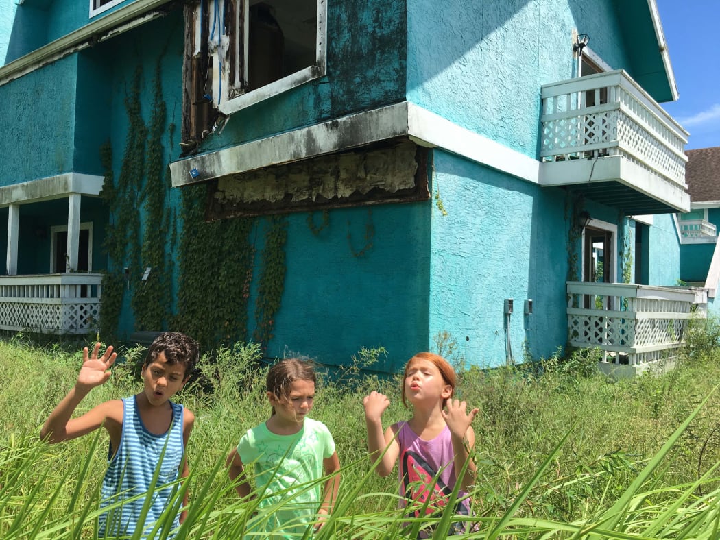 Christopher Rivera, Brooklynn Prince and Valeria Cotto explore the abandoned houses of Orlando in The Florida Project.