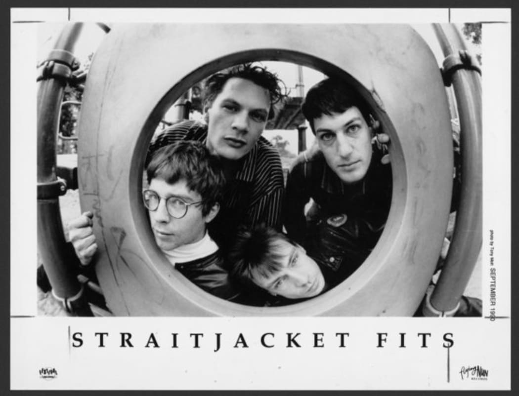 A black and white portrait of the band Straitjacket Fits.