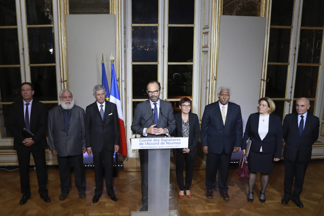 French Prime Minister Edouard Philippe (C), flanked by members of the Noumea Accord Signing Committee (Comite des Signataires.