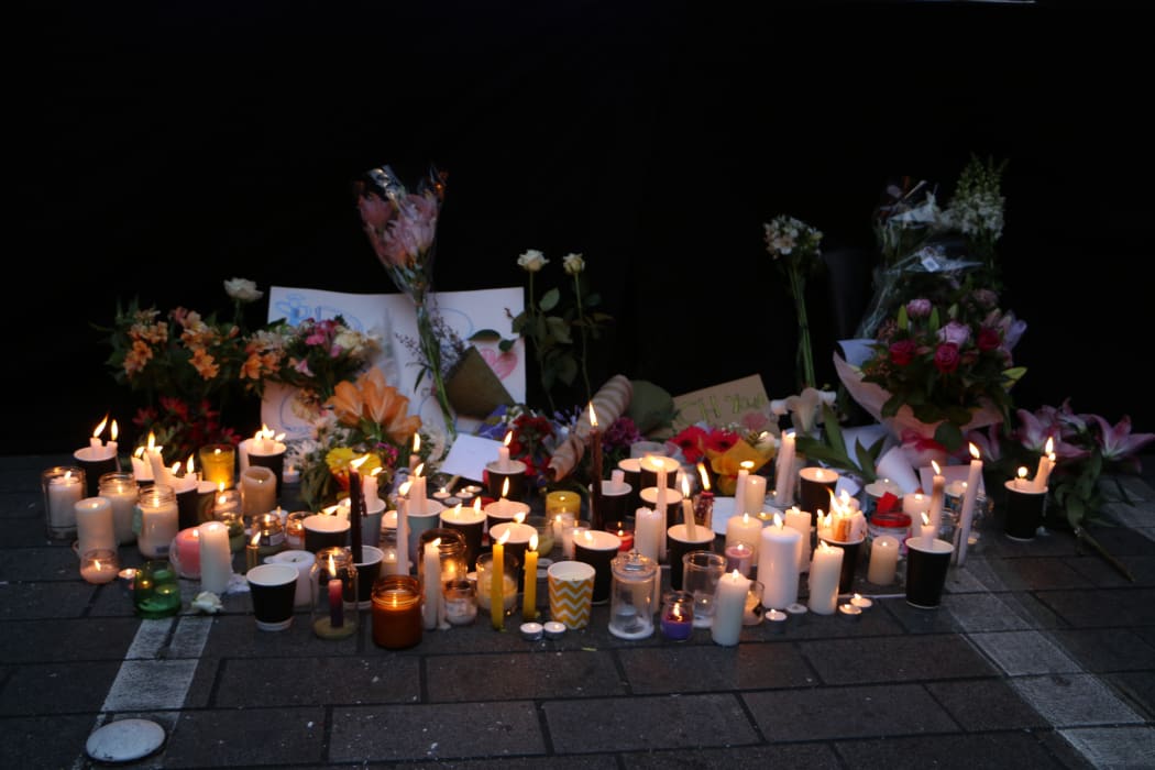 Flowers and candles were left for Grace Millane after the vigil in central Auckland this evening.