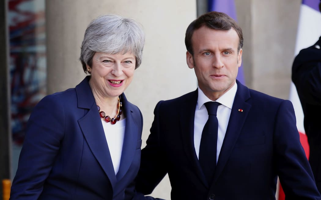 French President Emmanuel Macron and British Prime Minister Theresa May at the Elysee Palace in Paris Tuesday, April 9, 2019.