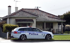 A police car is seen outside a house from where police recovered five dead bodies in the suburb of Australia's western city of Perth on September 10, 2018.