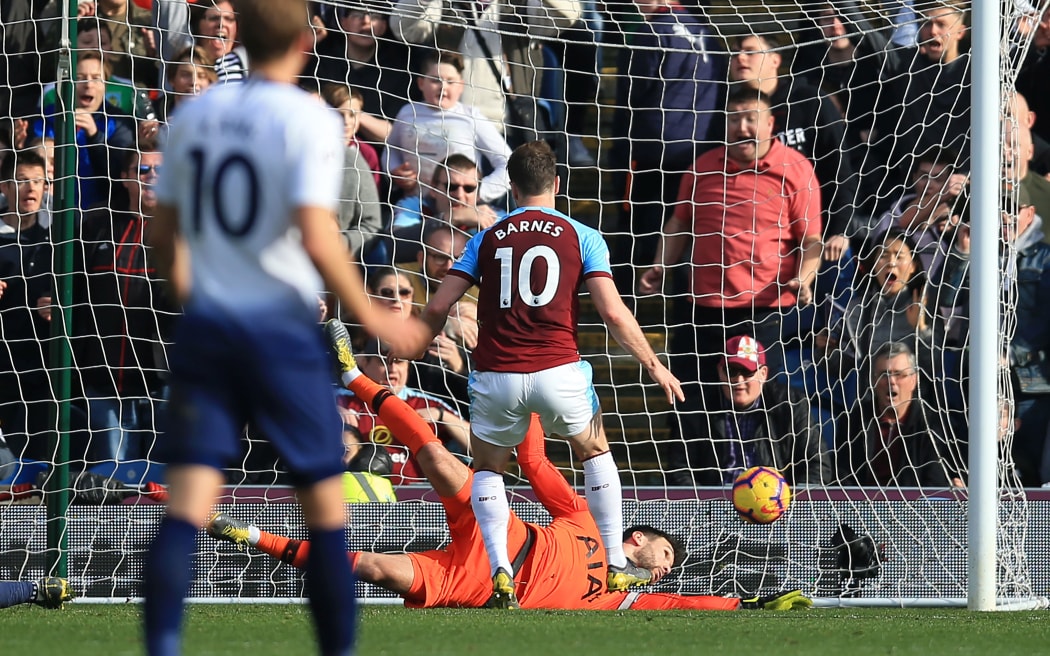 Ashley Barnes of Burnley beats Tottenham Hotspur goalkeeper Hugo Lloris to give Burnley a 2-1 lead