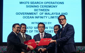 The MH370 search signing.