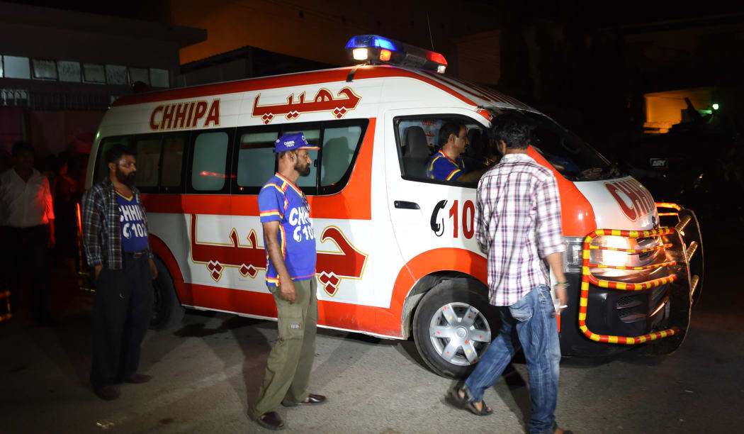 Volunteers transport Sabeen Mehmud's body after she was shot in Karachi.