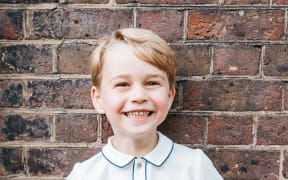 A handout picture released by Kensington Palace to mark Prince George's fifth birthday shows him smiling to camera.