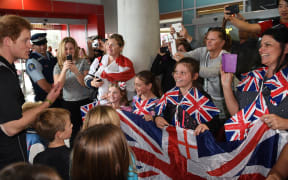 Prince Harry talking to young fans.