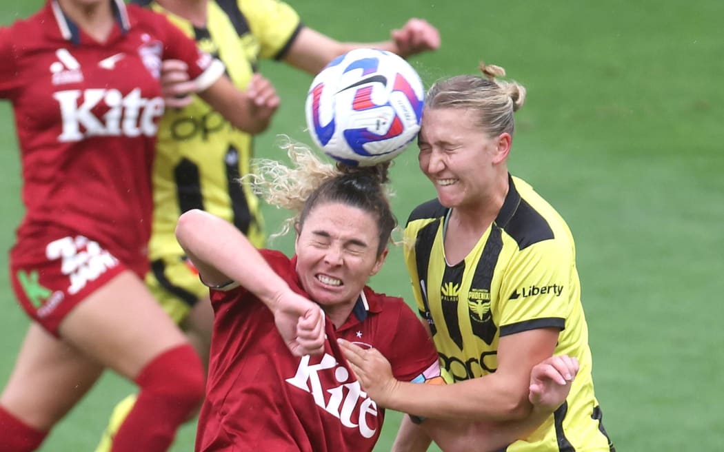 Phoenix defender Marisa Van Der Meer (right) competes for the ball in an A League match against Melbourne City.