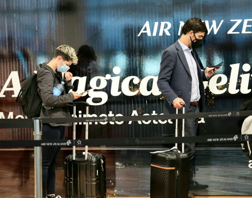 Passengers at Auckland Airport as the Covid-19 regional boundary was lifted on 15 December.