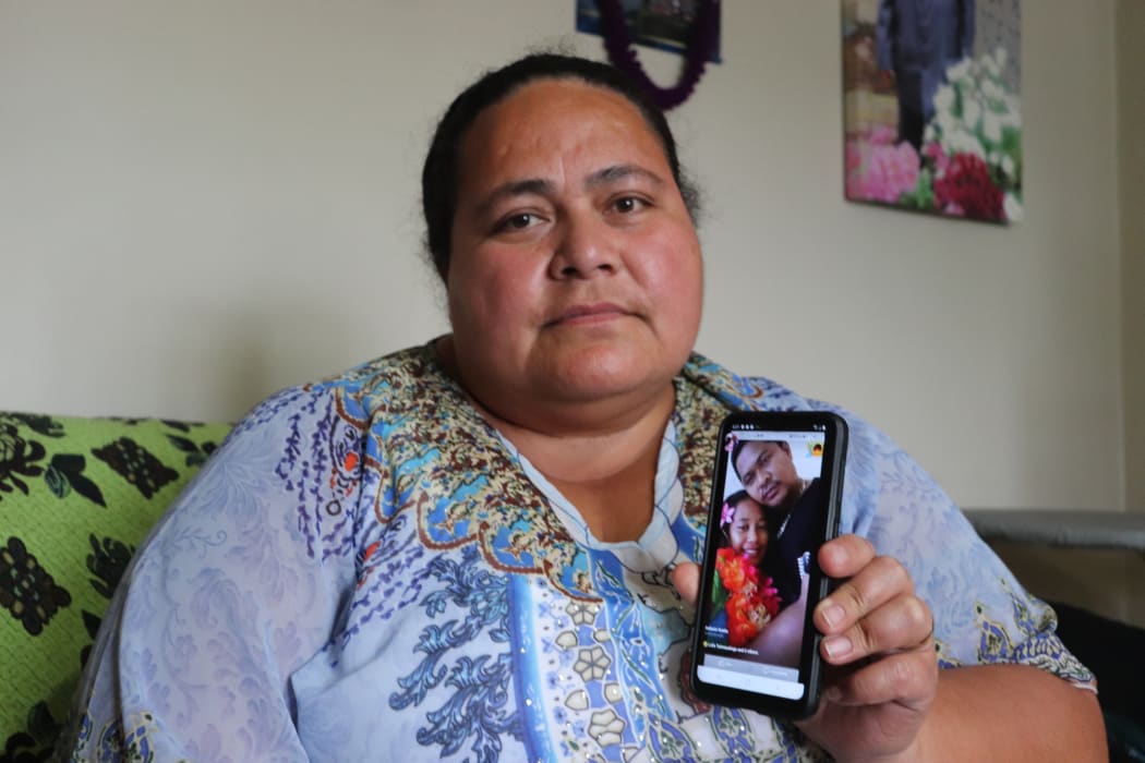 Lofa Tuimaualuga holds a photo of her nephew Tino Tagiilima, with his wife. Tagiilima died in a tragic highway crash in the North Island yesterday.