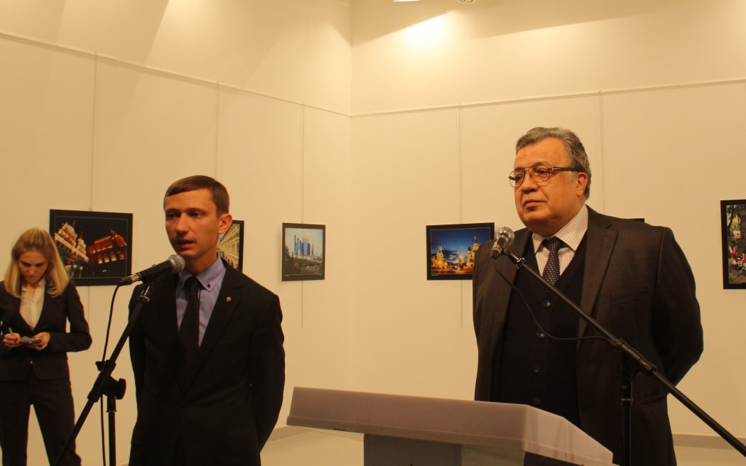 The envoy was giving a speech at the Modern Art Centre in Ankara when a gunman shot him.