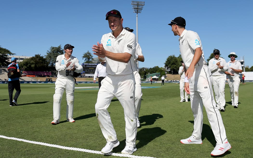 New Zealand's Neil Wagner is clapped off the field by team mates after taking his sixth five wicket bag in test cricket.
