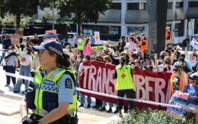 Police at a protest rally at St Patrick's Square in Auckland after the person accused of dousing Posie Parker with tomato sauce applied to have their charges dismissed.