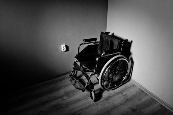 Wheelchair in a dark room
