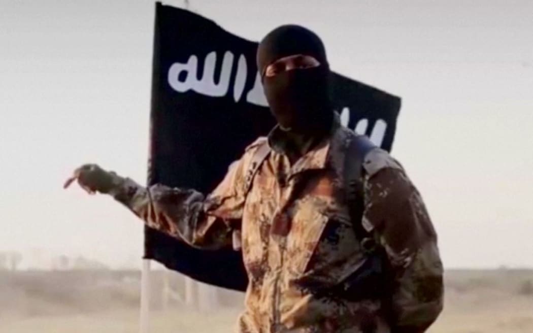 An Islamic State militant, who is believed to have a North American accent.