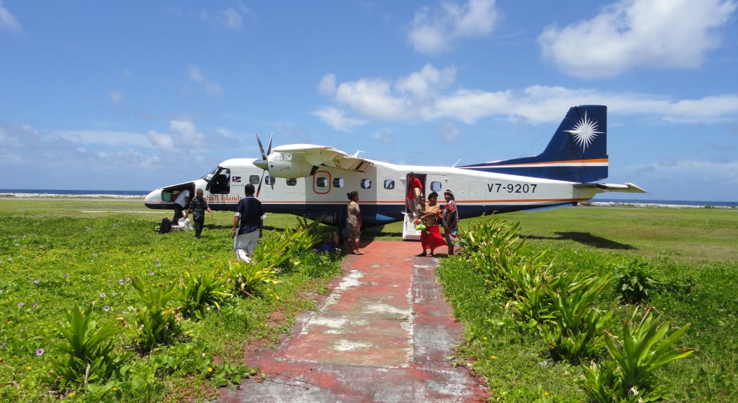 An Air Marshall Islands plane offloads passengers and cargo at Jaluit Atoll. Air Marshall Islands is one of 11 SOEs that are part of a major reform