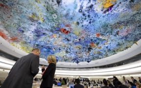 Delegates speaks prior to the opening of a session of the Human Rights Council on the Palestinian territories situation on March 23, 2015 in Geneva.