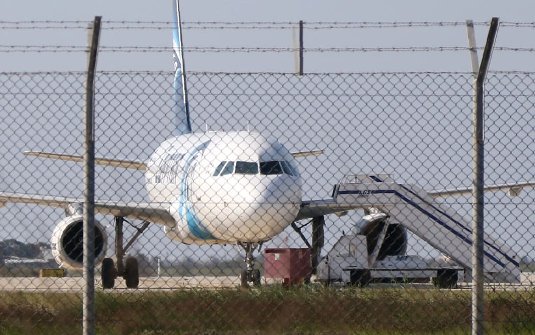 An EgyptAir Airbus A320 sits on the tarmac of Larnaca aiport after it was hijacked and diverted to Cyprus on 29 March 2016.