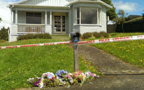Flowers were left at the Kiwi Street house.
