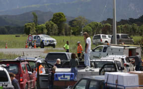 Dozens of people wait to be allowed to travel out of Kaikoura on the inland route.