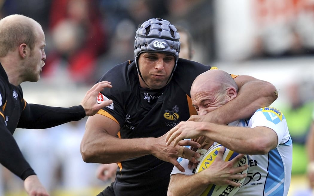 Marco Wentzel of London Wasps tackles Paul Hodgson of Worcester Warriors during an English Premiership match between London Wasps and Worcester Warriors.