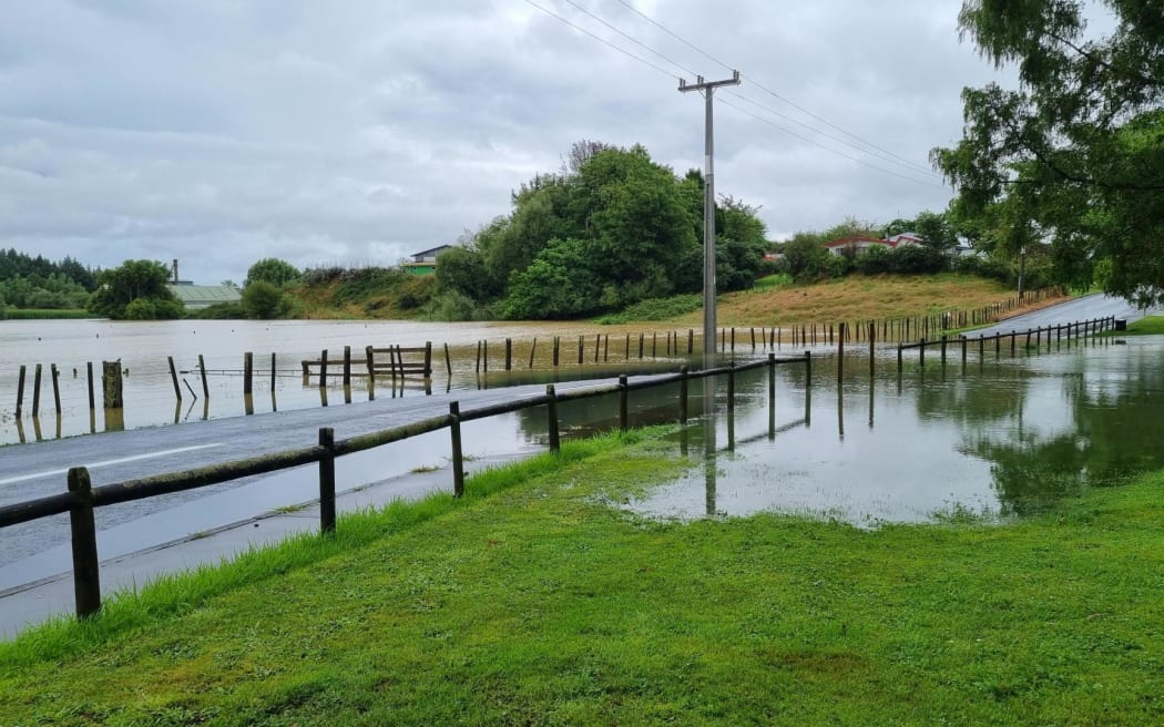 A local road covered by rainwater which has turned local paddocks into a lake in Piopio, Waitomo However, a slip on the southern approach to town, which had reduced SH3 to on lane has been cleared. Locals say the rain was torrential earlier today but has eased.