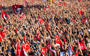 Tens of thousands of people take part in a pro-democracy rally in Istanbul, condemning the nation's attempted coup.