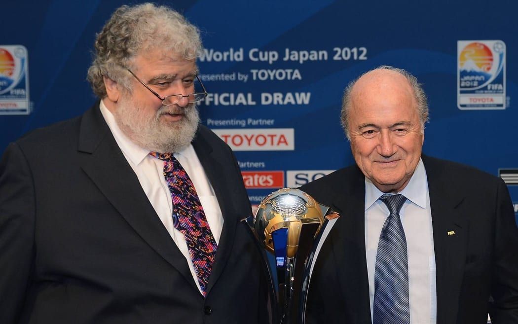 Ex-Fifa-Member Chuck BLAZER (USA, FIFA Executive Committee) and outgoing FIFA President Sepp Blatter posing with the Club World Cup in 2012.