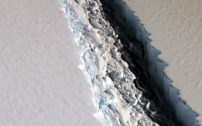 This NASA photo released December 1, 2016 shows what scientists on NASA's IceBridge mission photographed in a view of a massive rift in the Antarctic Peninsula's Larsen C ice shelf on November 10, 2016.