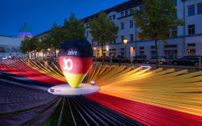 A black-red-golden heart is in the centre of black, red and yellow fabric panels in the exhibition "Path to Unity" at the Unity EXPO. Potsdam, as the capital of Brandenburg, is this year's host of the central celebrations of German Unity Day.