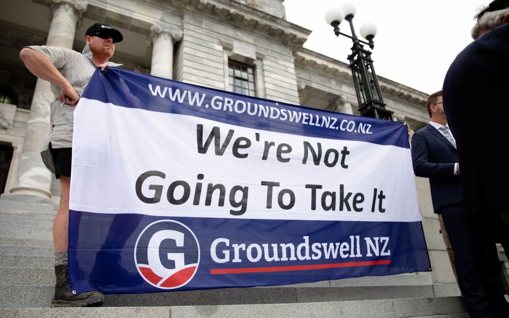 Representatives from Groundswell NZ deliver a petition to Parliament against the emissions trading scheme.