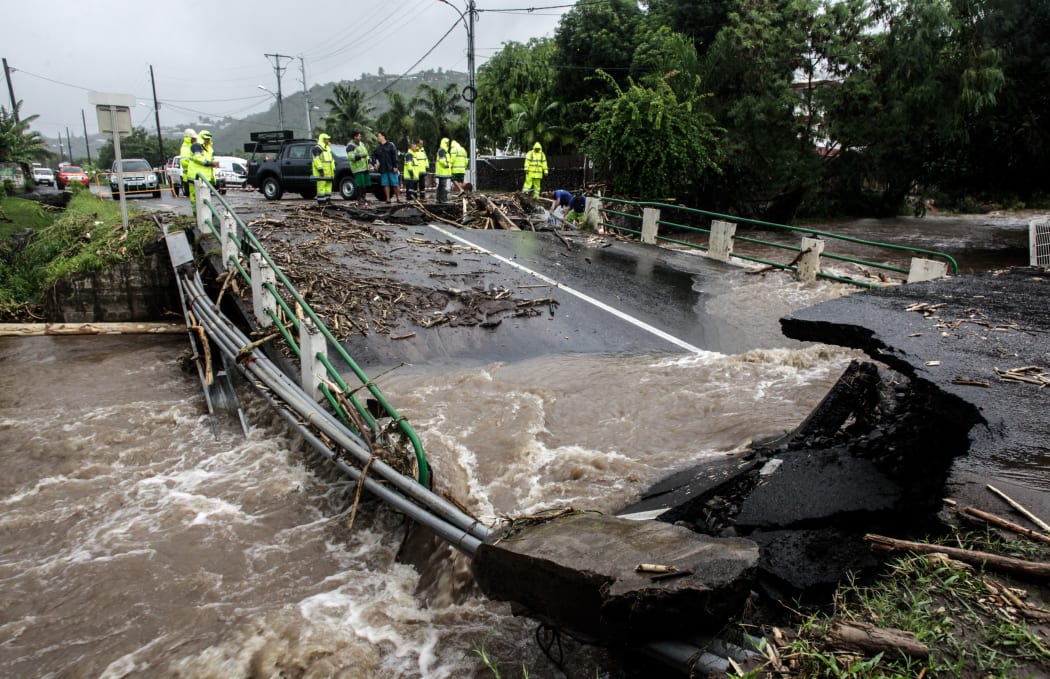 A road damaged after floods due to heavy rains on Tahiti.