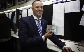 John Key placing his bet for the Melbourne Cup at Trax Bar, Wellington Railway Station