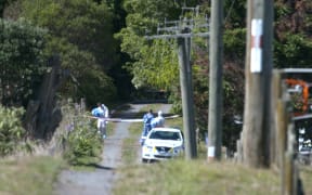 Photographs from outside the cordon at the crime scene in Kingseat.