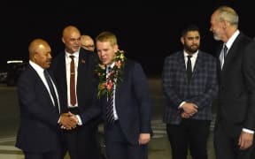 Papua New Guinea officials receive Prime Minister Chris Hipkins , centre, at Port Moresby International Airport on 21 May, 2023, ahead of the Forum for India–Pacific Islands Cooperation (FIPIC) Summit in Papua New Guinea.